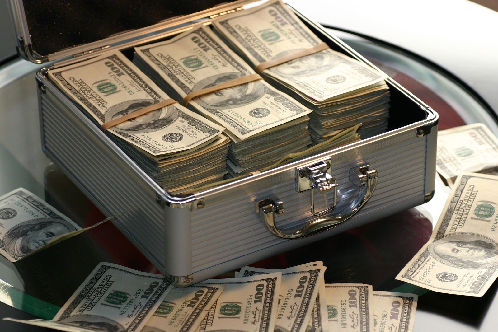 A briefcase overflowing with cash