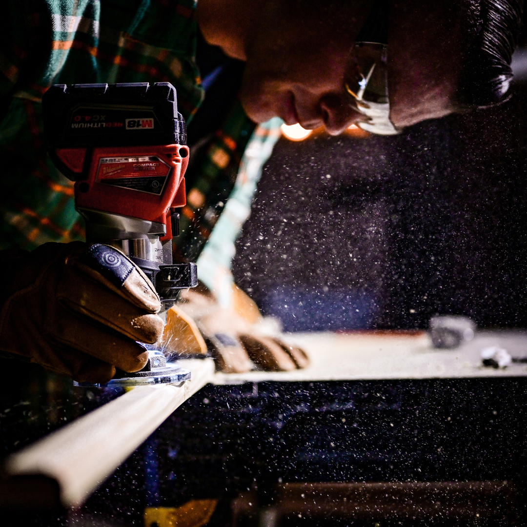 Man using carpentry tools in a workshop