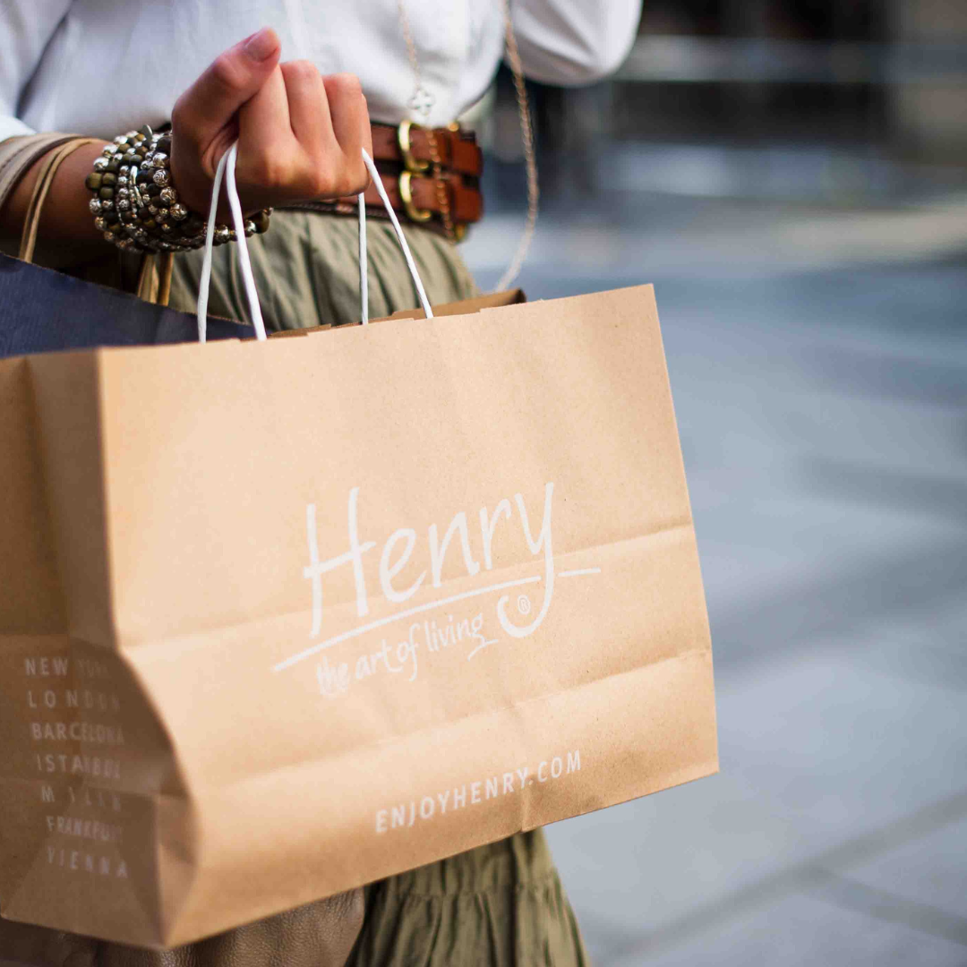 customizes paper bag with henry written on it