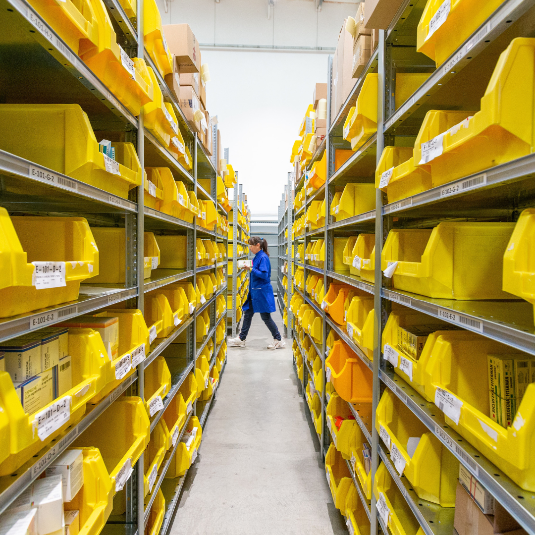 Woman walking down in a warehouse