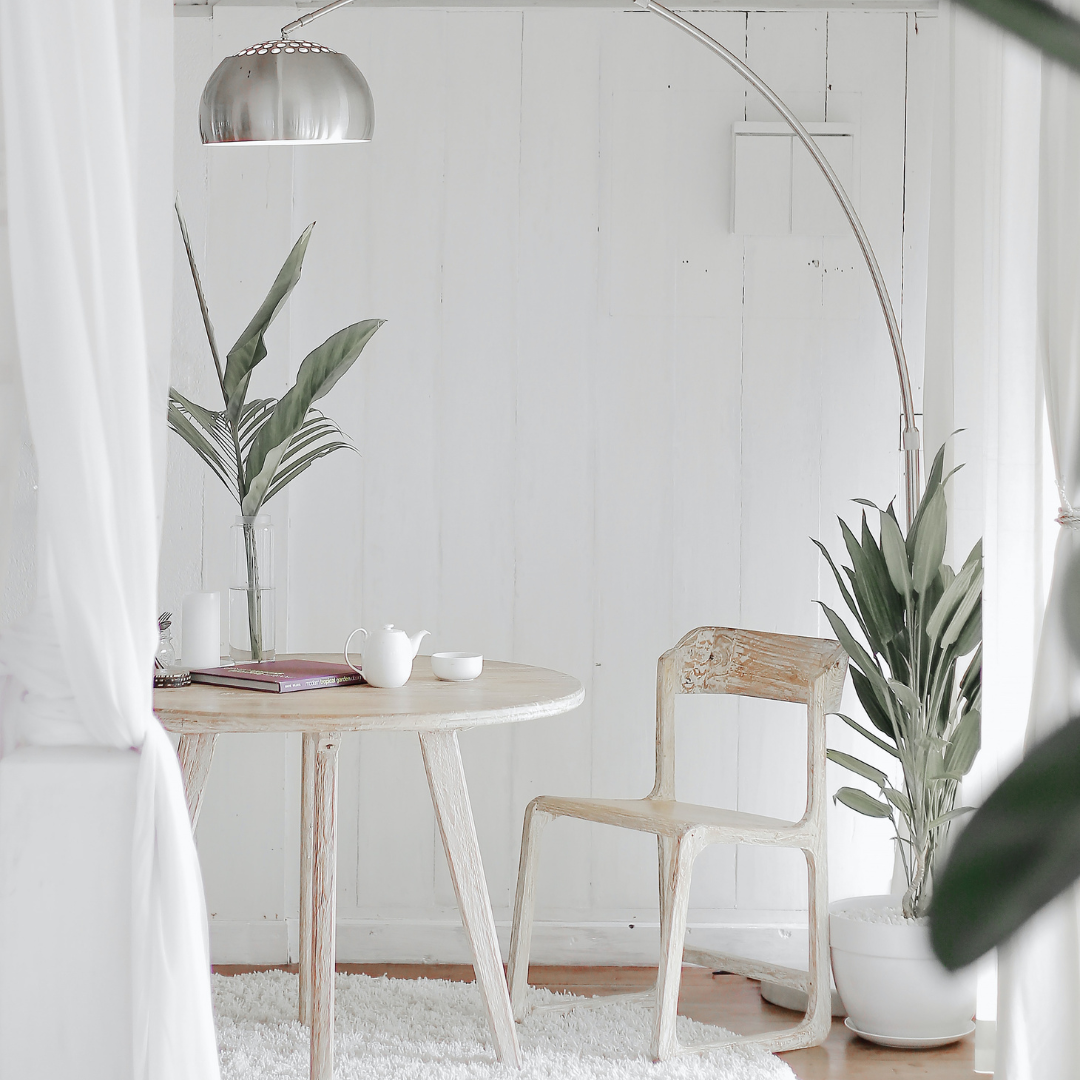 white table, chair and curtains