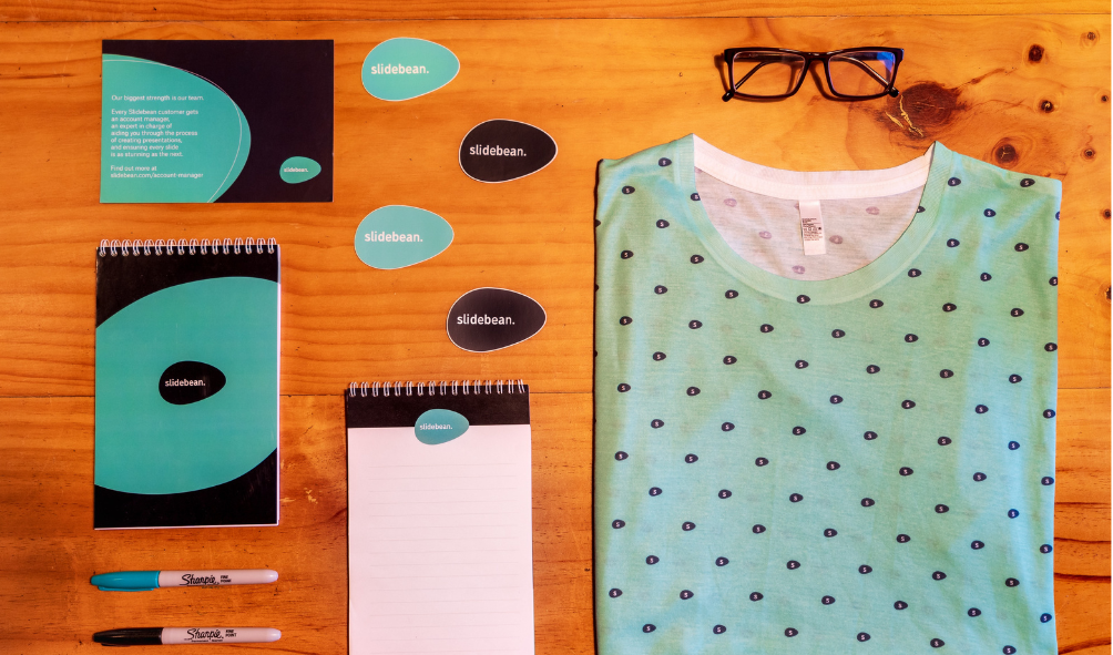 Visual identity with books, notepads, and tshirt