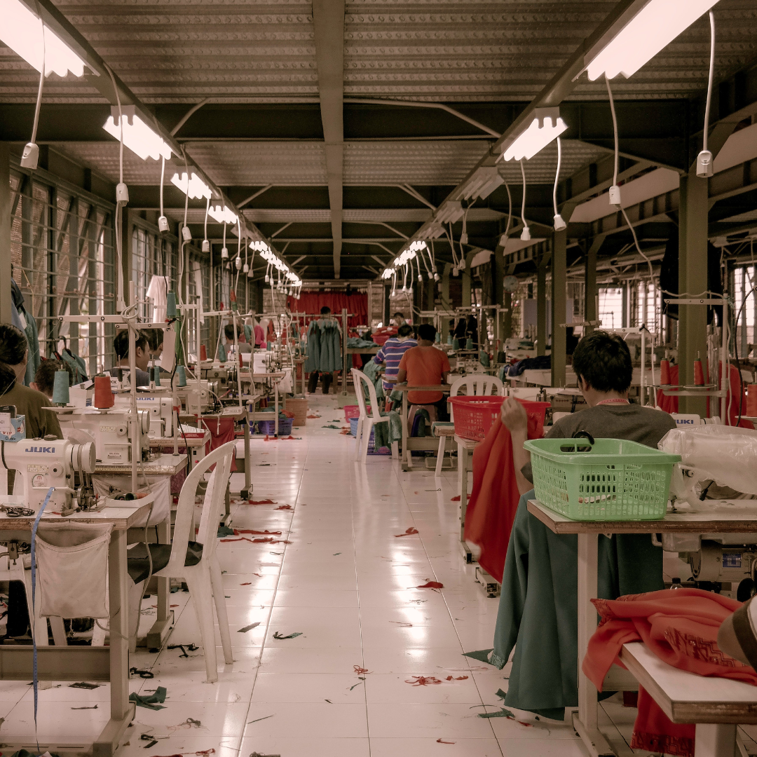 garment manufacturing unit with people and sewing machines