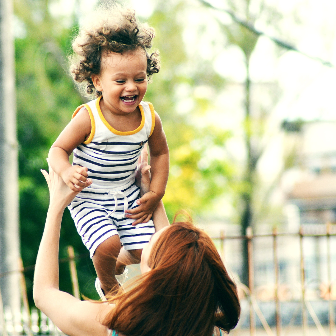 A woman playing with a child