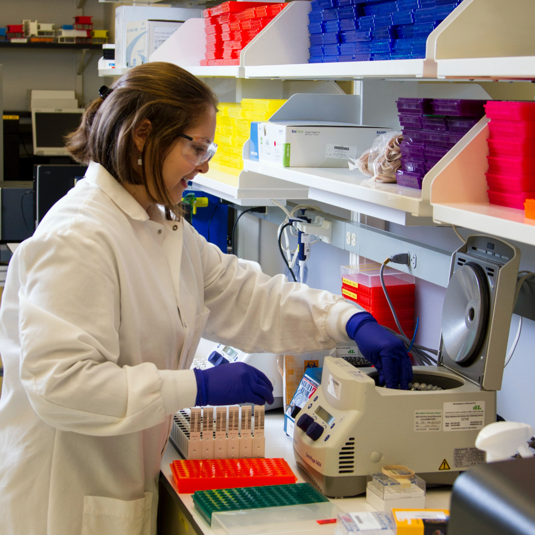 lady working in a lab promoting chemical production safety